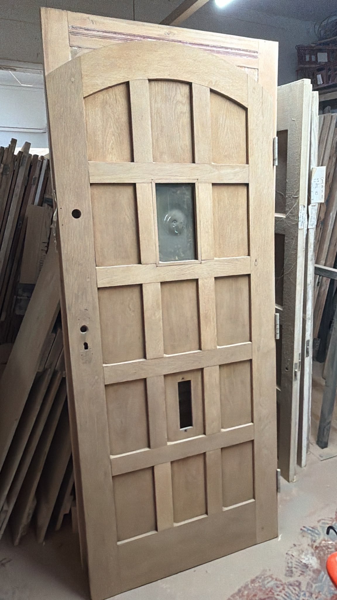 Original arched oak exterior door stripped and restored to reveal the natural oak grain